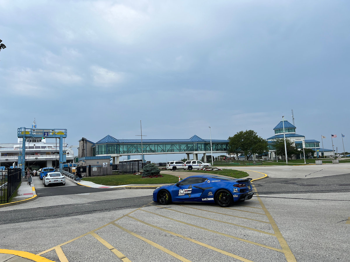 Blue sports car going on Ferry