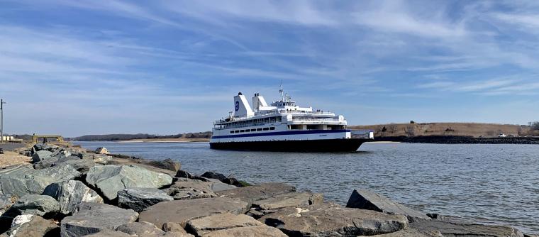 The Cape May-Lewes Ferry departs from the Cape May Terminal with the Cape May Canal and Higbee Wildlife Management Area in the background