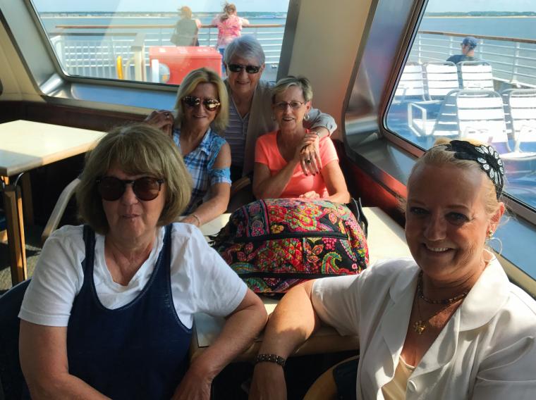 Passengers posing for picture inside the Motor Vessel