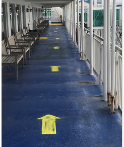 floor decal arrows to show how to walk around the Ferry on exterior decks