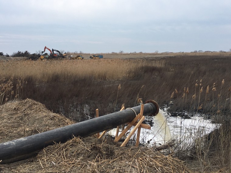 water disposing silt into the contaned disposal facility