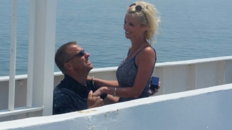 Groom proposing to his intended bridge on the catwalk by the Captain's bridge
