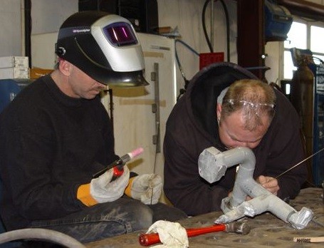 (l-r) Welder John Altieri and Vessel Maintenance Lead Don Miller repair pipes to help sister Ferry Sankayty out of Woodshole to get back underway