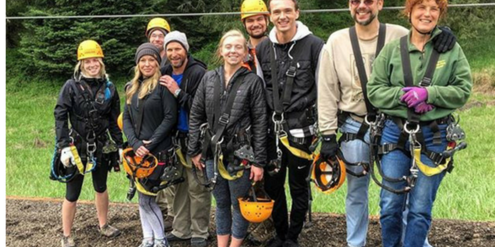 multi-generational group of tree climbers at Tree to Tree Adventure Park