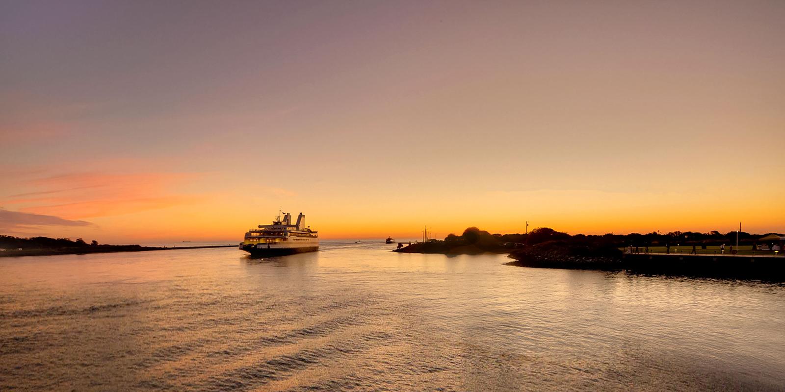 Cape May-Lewes Ferry sailing into port at sunset