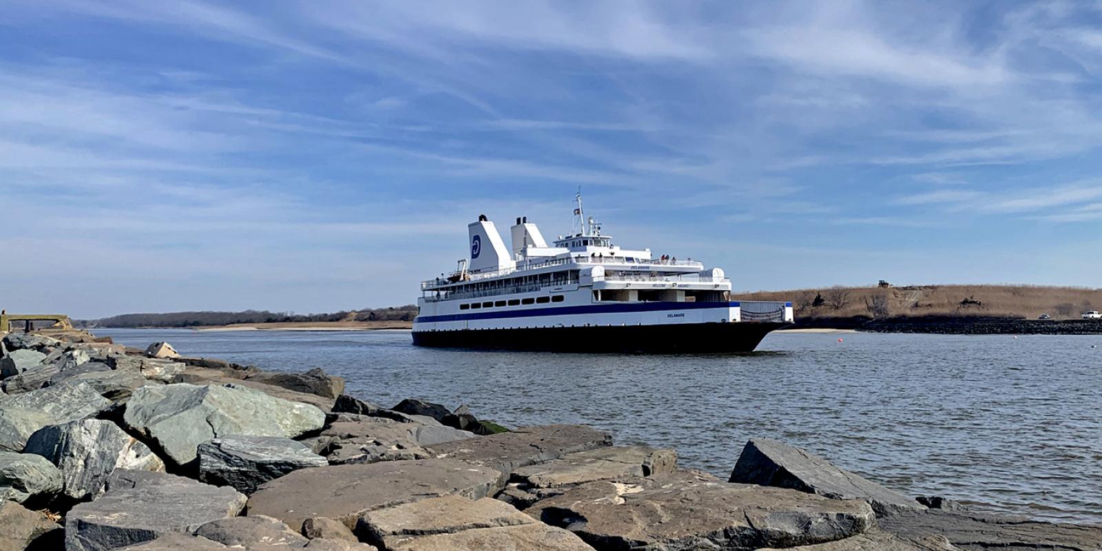 The Cape May-Lewes Ferry departs from the Cape May Terminal with the Cape May Canal and Higbee Wildlife Management Area in the background