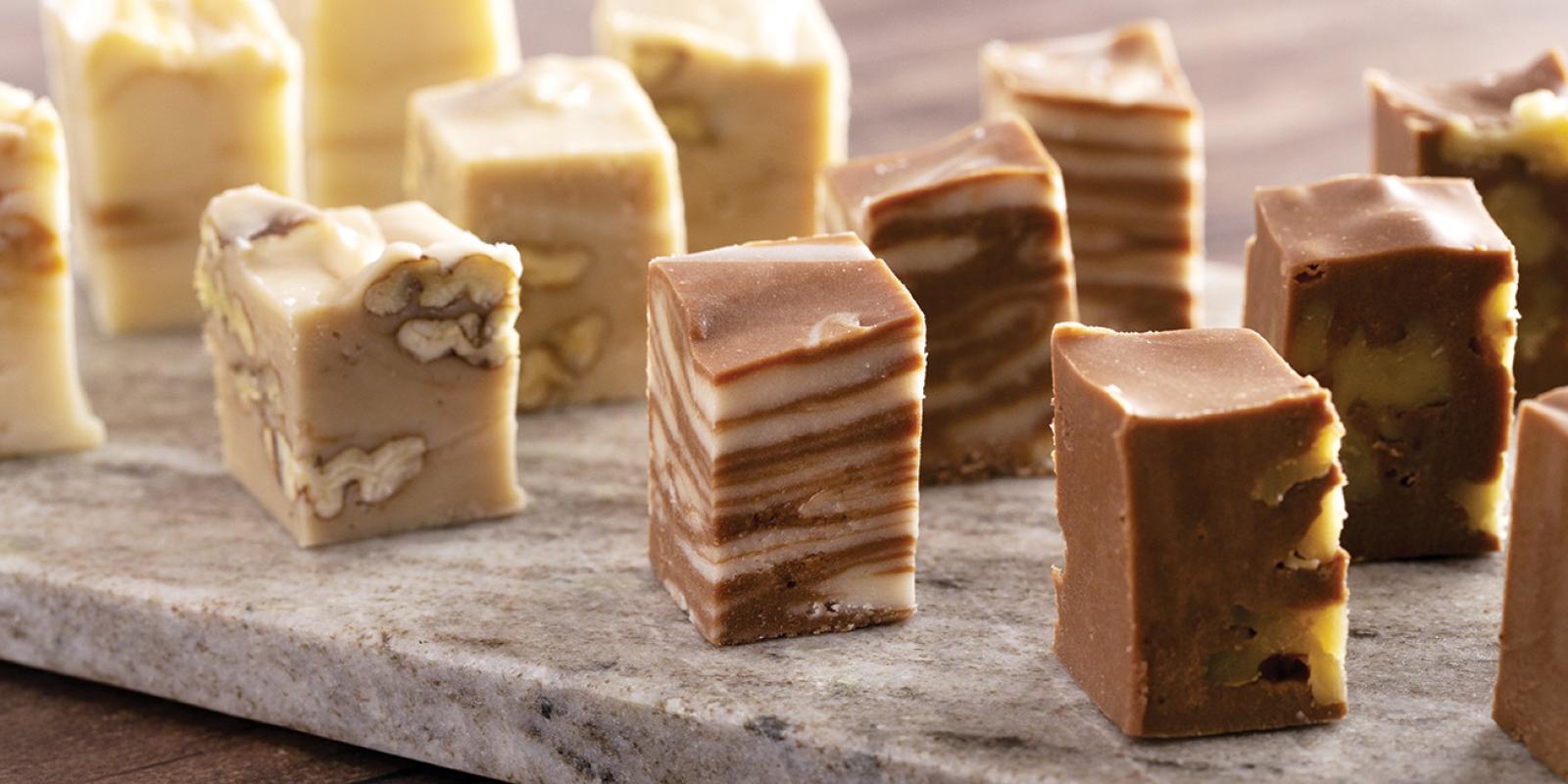 fudge samples lined up on a tasting board