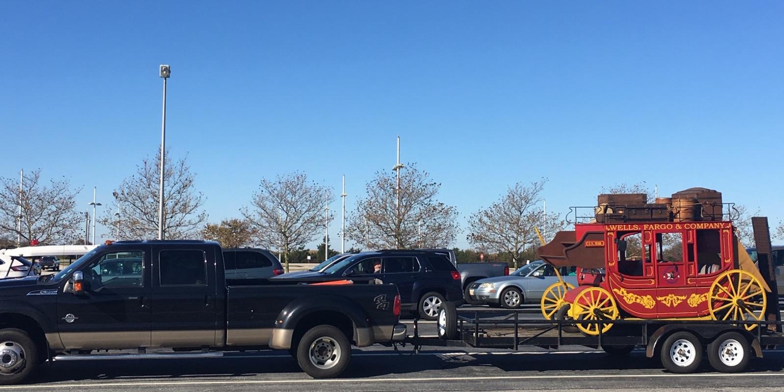 Wells Fargo parade vehicle being towed on to the Cape May-Lewes Ferry