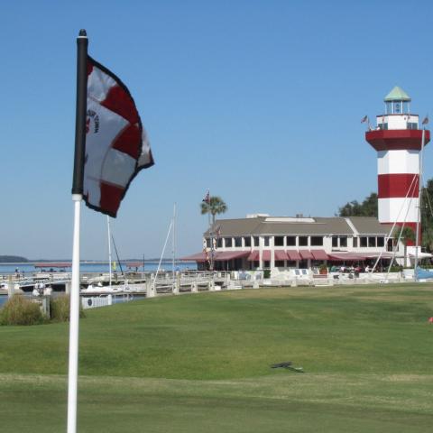 Golf course with lighthouse in background