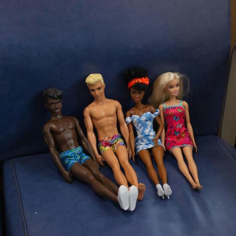 ken and barbies seated inside the ferry