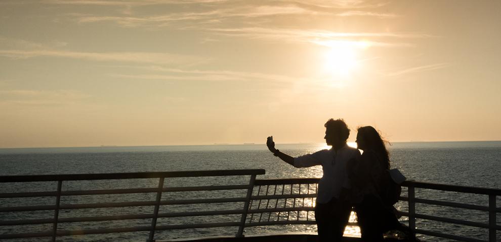 Couple riding the Cape May Lewes Ferry at Sunset