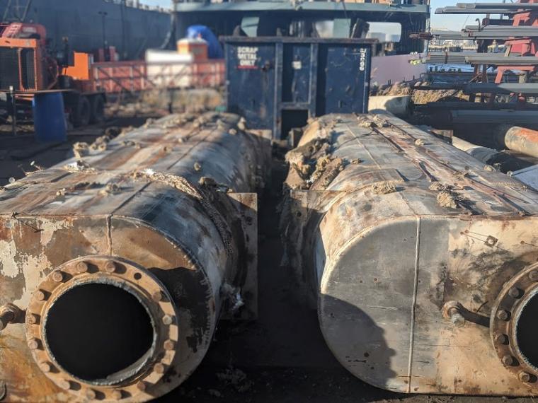 Old ferry mufflers being removed