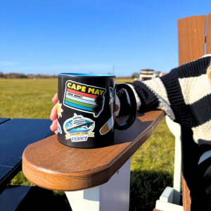 A Cape May - Lewes Ferry sticker mug featuring the Ferry logo and designs for Cape May and Lewes, De as well as other items representing the ferry.