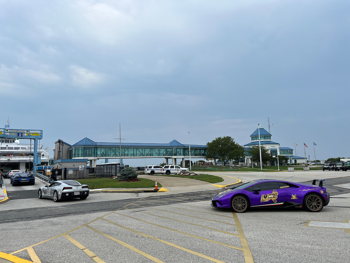 Blue sports car going on Ferry