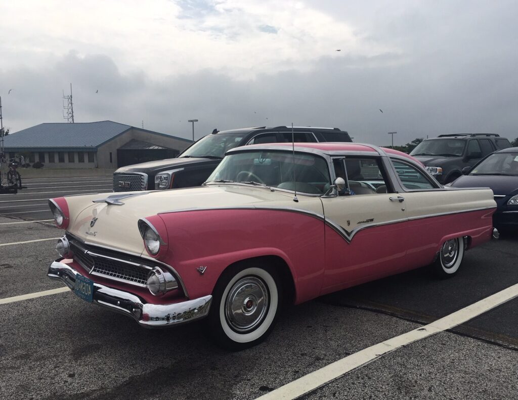 Vintage pink car parked in the Terminal parking lot