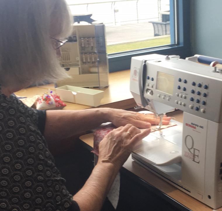 close up of quilt block being sewn at the Cape May ferry terminal salon.