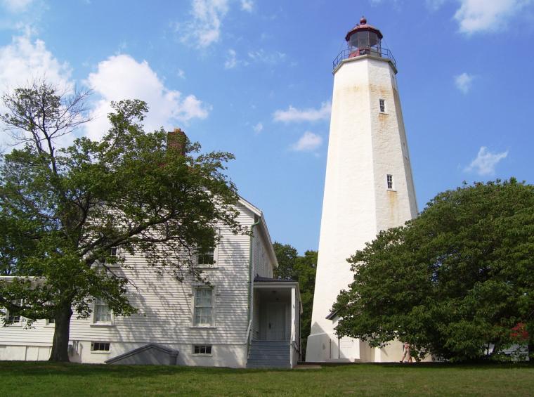A ground level view of the light house in Sandy Hook, NJ