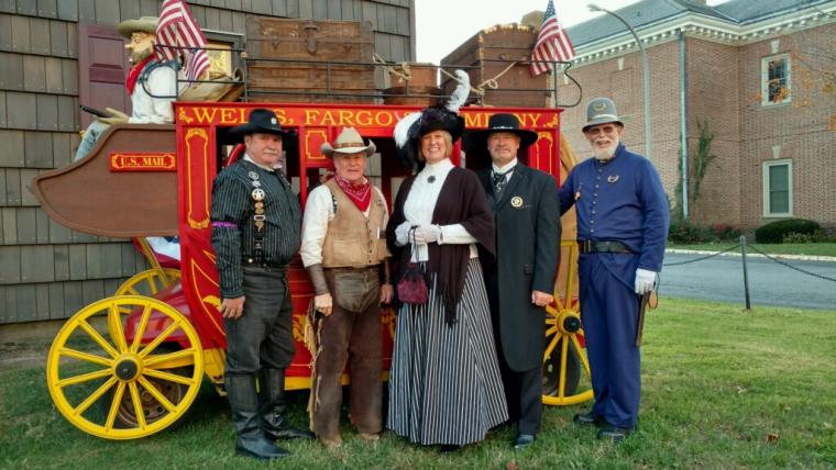 Return Day parade participants with the mini Wells Fargo Stage Coach