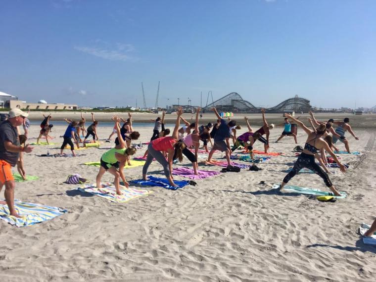 Yoga class being held on the beach in Wildwood, NJ