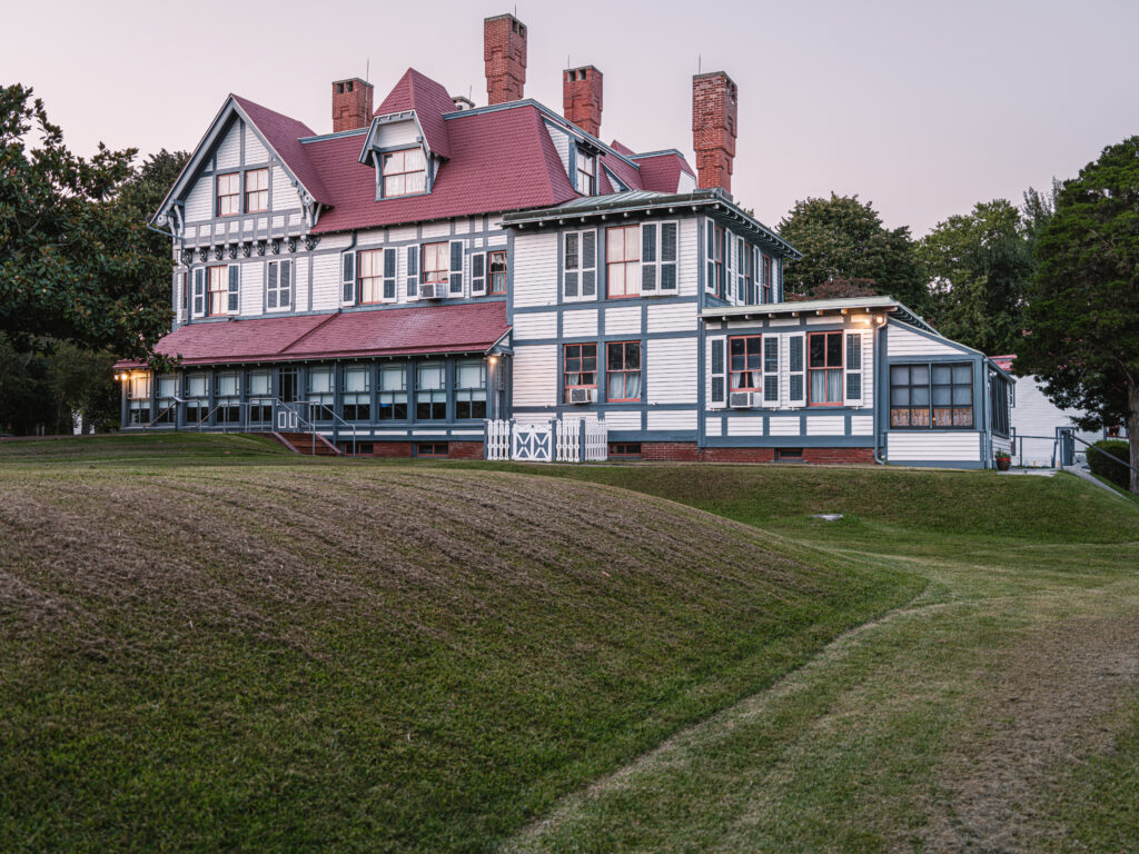 Historic Emlen Physick Estate at 1048 Washington Street in Cape May, NJ, operated by the Mid-Atlantic Center for the Arts and Humanities, featuring ornate Victorian architecture and trolley tours near Cape May's main bike routes.